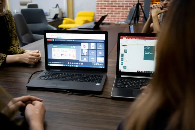 Team discusses projects during a virtual and in-person meeting in a Dubai office. Qualitative research trends: a 2027 readiness guide